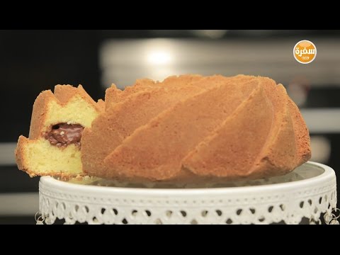 بالفيديو طريقة عمل ومقادير كيك بحشوة كاسترد الشوكولاتة