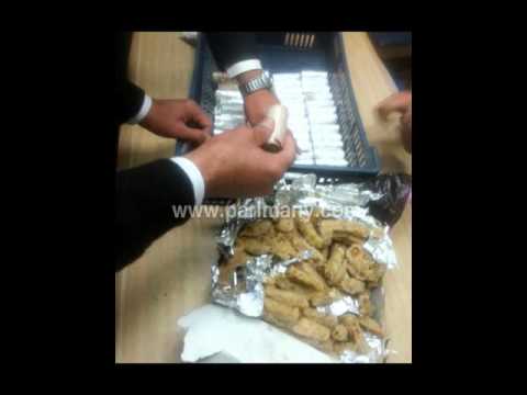 شاهد إحباط تهريب نصف مليون جنيه داخل محشي